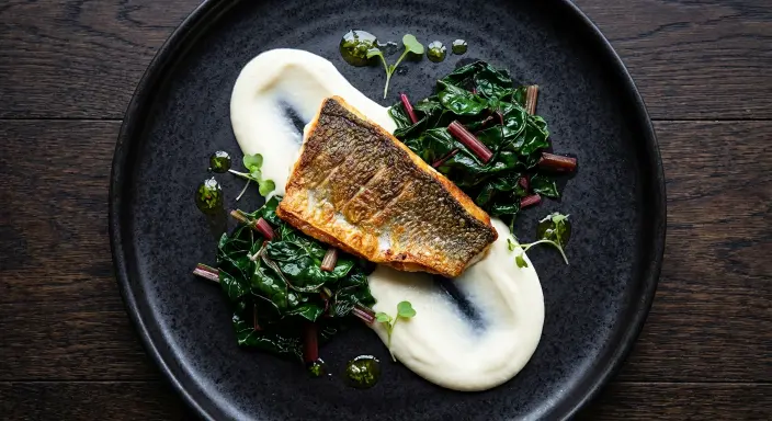 Sea bass with cauliflower and mustard garlic puree, Swiss chard